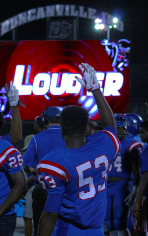 Varsity football players line up for the start of a game with Mesquite horn for the first game in with a new video scoreboard.(Photo by Alexis Rosebrock)