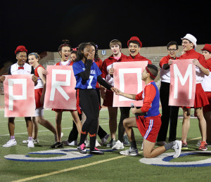 Senior Chris Soto surprised his girlfriend Christie Lewis with a "prom-posal" in front of the audience at Powder Puff. Lewis said yes! (Photo by: Alexis Rosebrock)